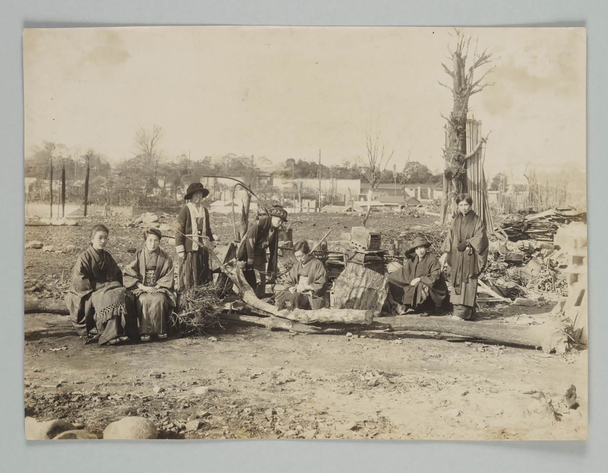 Students and faculty stand in front of the remains of school building destroyed by a fire following the Great Kanto Earthquake, 1923,  Courtesy of Tsuda University Archives