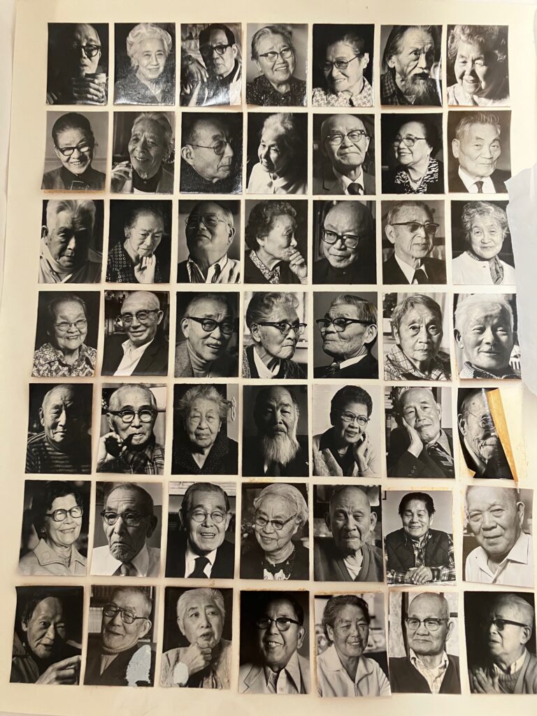 A page of small black and white portraits of older Japanese people, both men and women. There are 49 portraits total in 7 lines of 7.