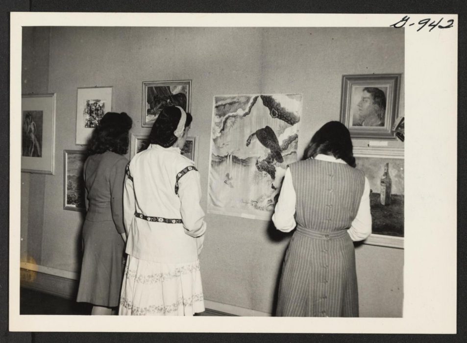 War Relocation Authority photographer, Students at the New Jersey College for Women, New Brunswick, New Jersey, view an exhibit of paintings and sculptures by Issei and Nisei artists, 1945. Photograph. War Relocation Authority Photographs of Japanese American Evacuation and Resettlement, BANC MSS 67/14 c, The Bancroft Library, University of California, Berkeley; digital ID jvac_cubanc_43_1_00075868; ark:/13030/ft6j49p000.